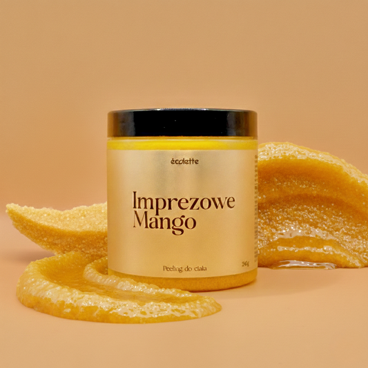Peeling Imprezowe Mango Écolette w aranżacji z pokrojonym mango podkreślającym egzotyczny zapach produktu.
